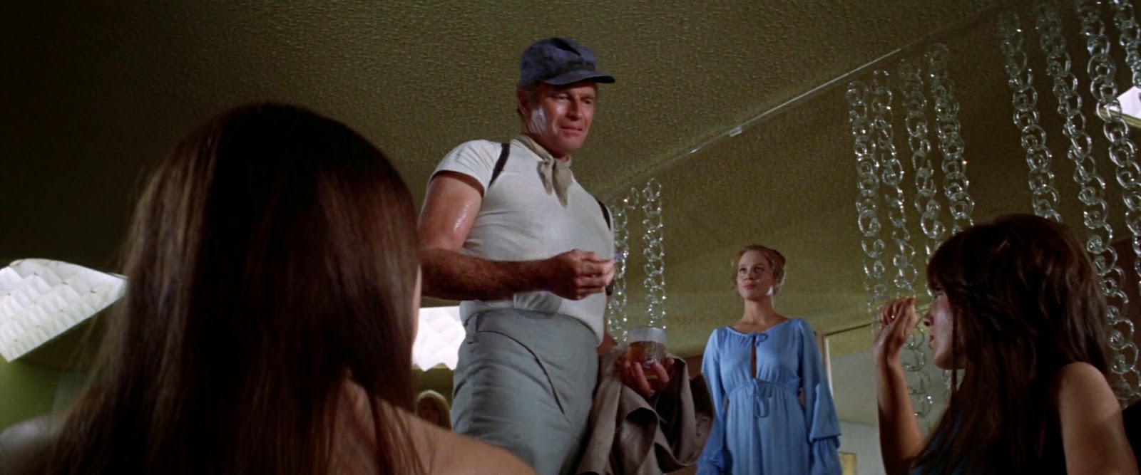 Charlton Heston + Leigh Taylor-Young - Soylent Green (1973) admiring the furniture 2